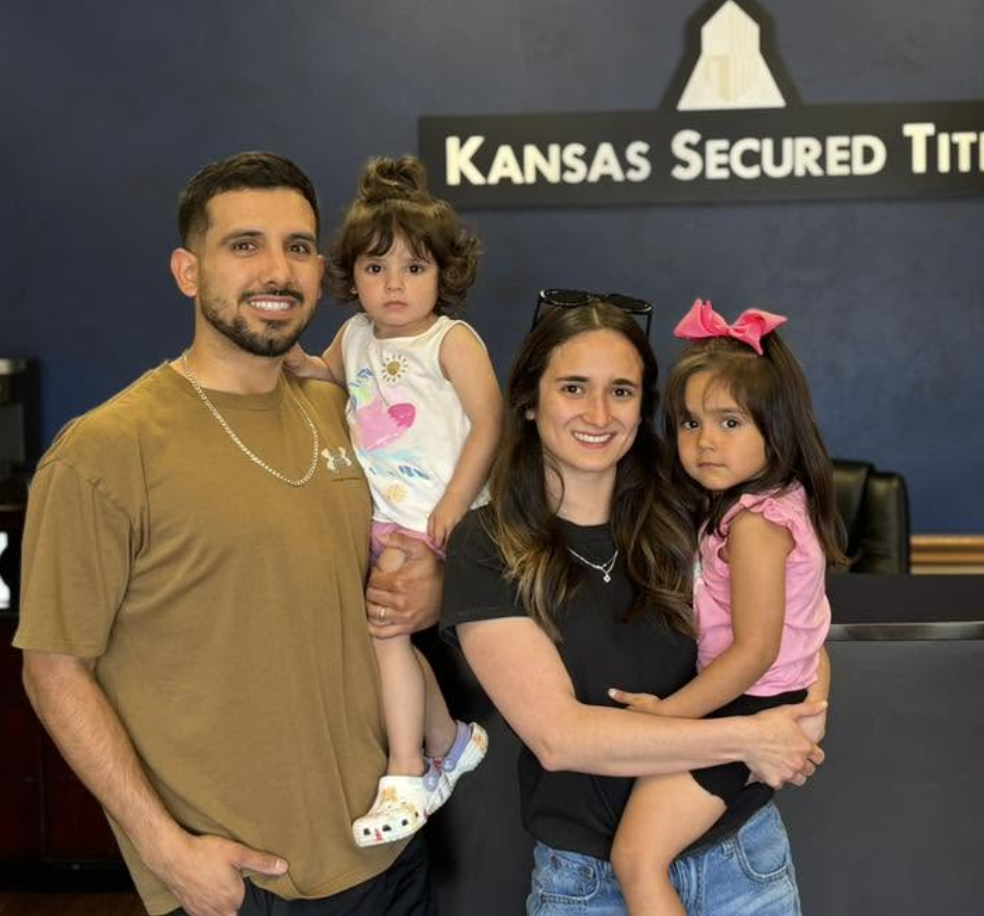 Wichita real estate investor family at their closing at Kansas Secured Title