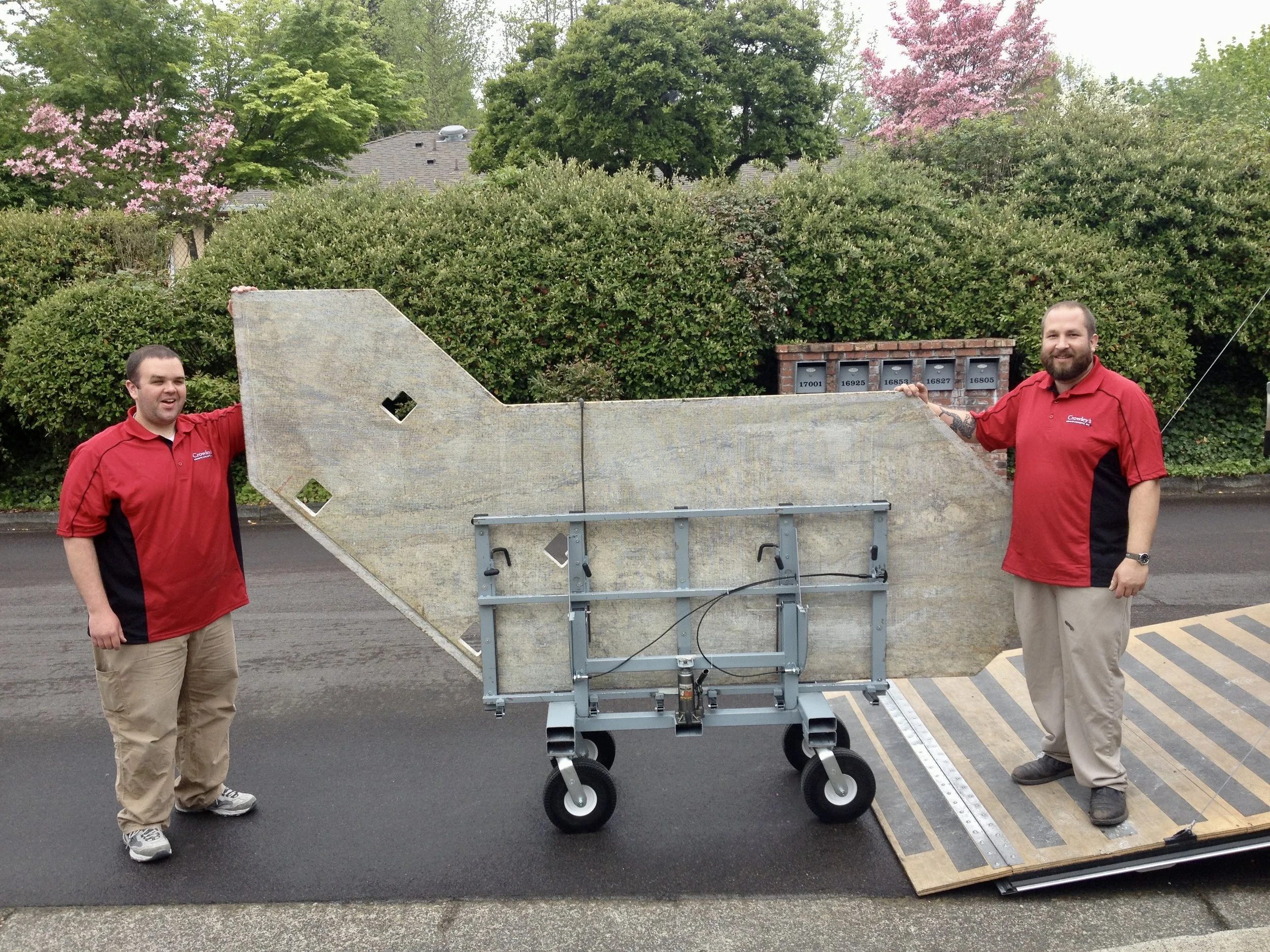 Version 2 of the No Lift System install cart, fully assembled with a large granite countertop loaded on edge at the trailer ramp