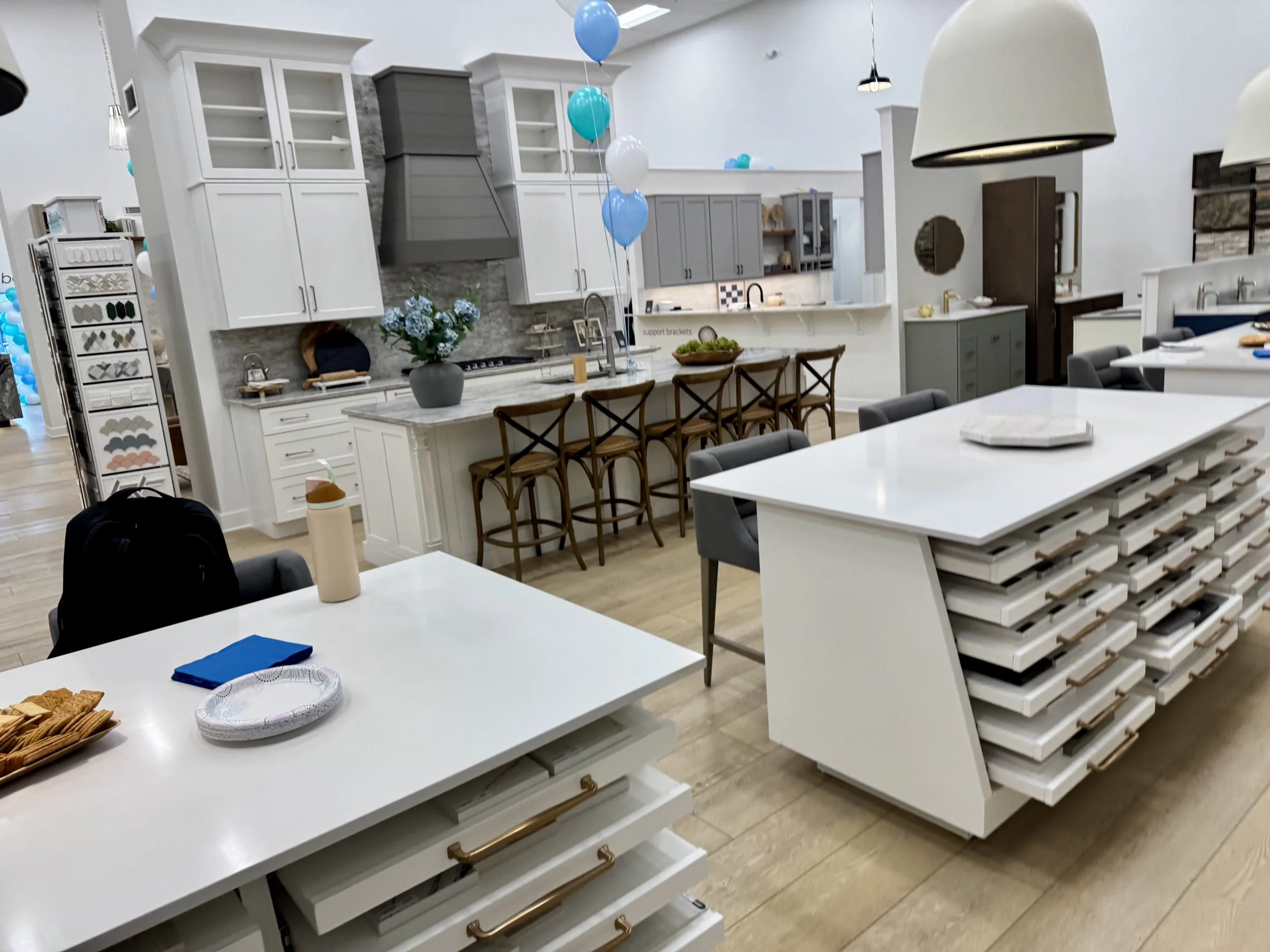 Stone fabrication showroom filled with granite and quartz slab samples