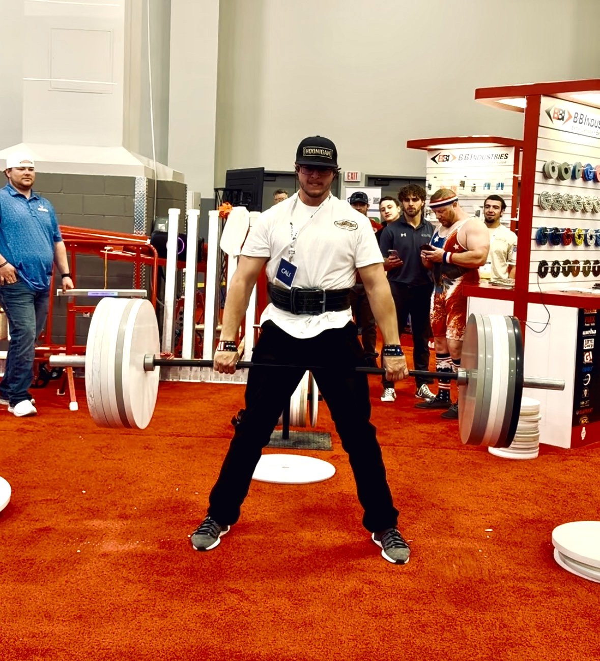 Installers competing in a quartz plate barbell lifting contest at TISE 2026
