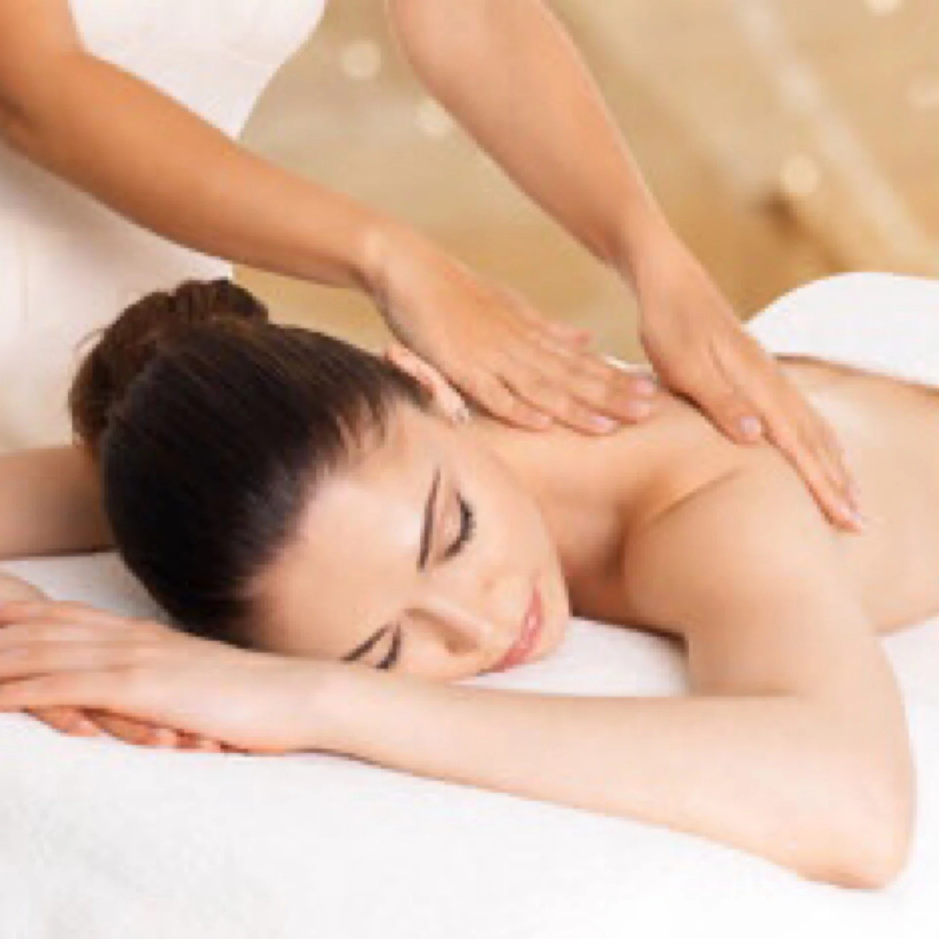 Hands performing a Swedish-style massage