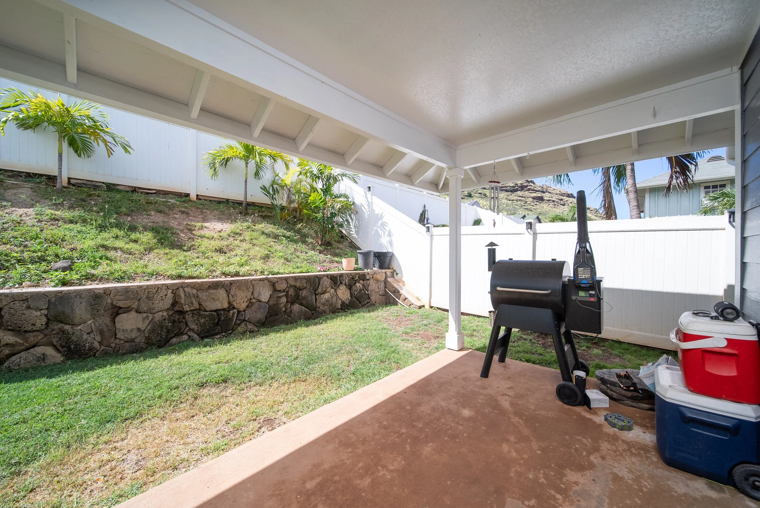 Covered lanai with grill and fenced yard at 87-1041 Huamoa Street, Waianae