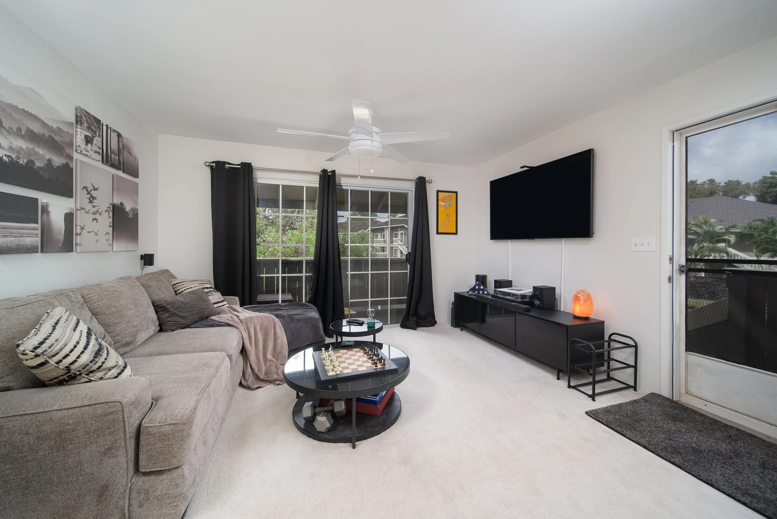 Living room with sliding glass door to the lanai at 94-1351 Kulewa Loop, Waipio Gentry