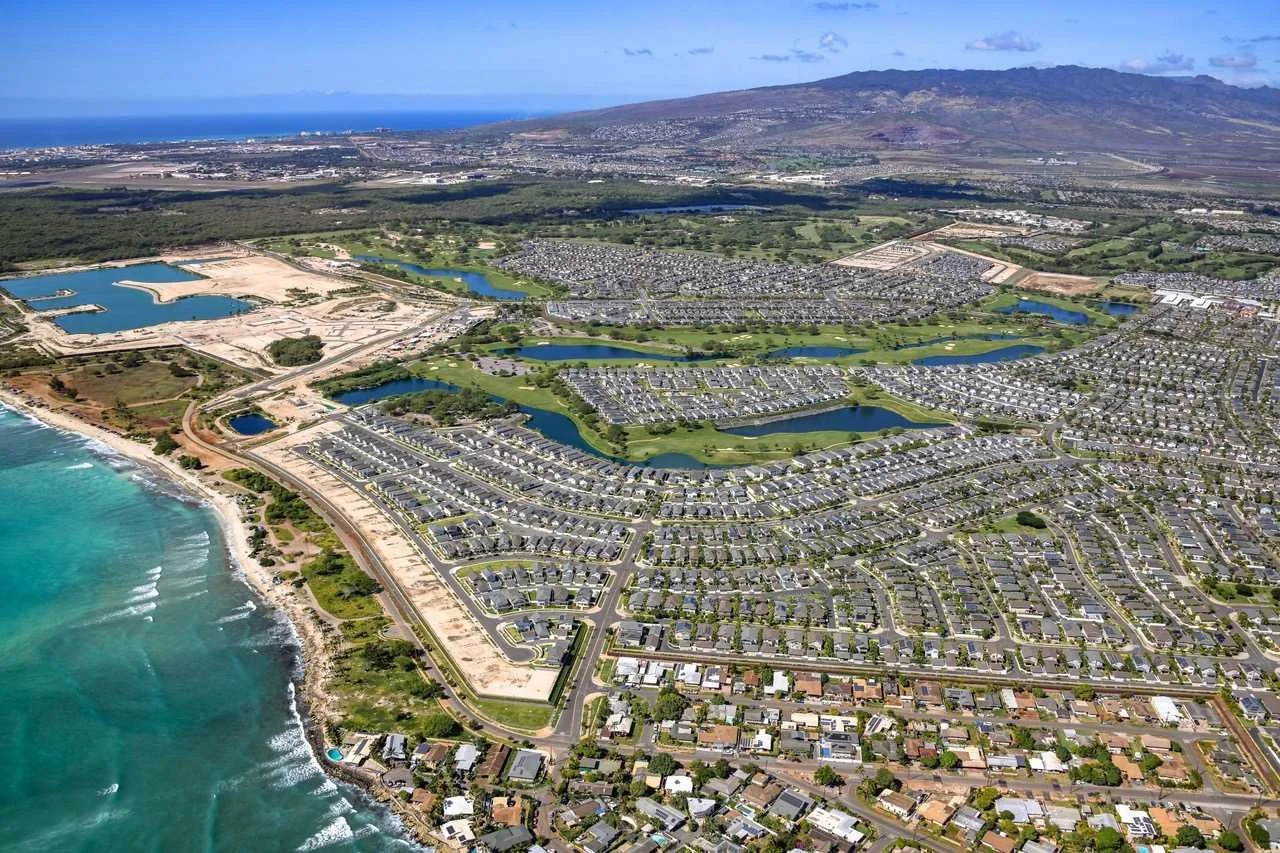 Aerial view of Leeward Oʻahu neighborhoods stretching from the coastline inland