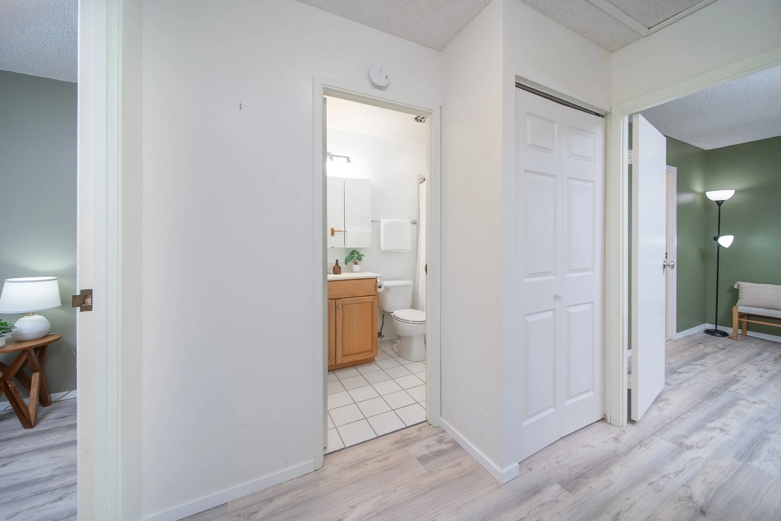 Upstairs hallway with linen closet and bathroom doorway
