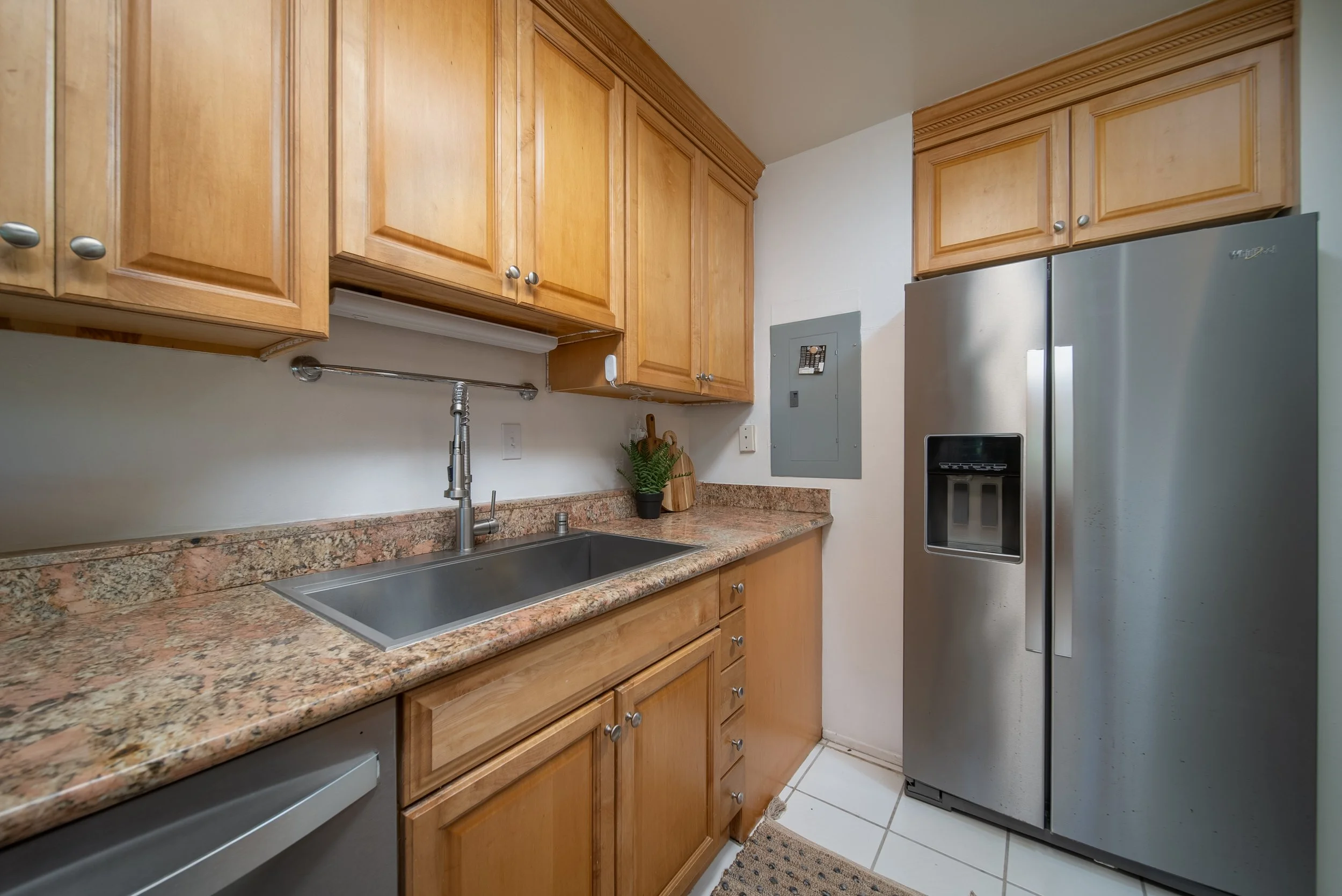 Kitchen with granite counters, stainless refrigerator and dishwasher, Nob Hill Mililani