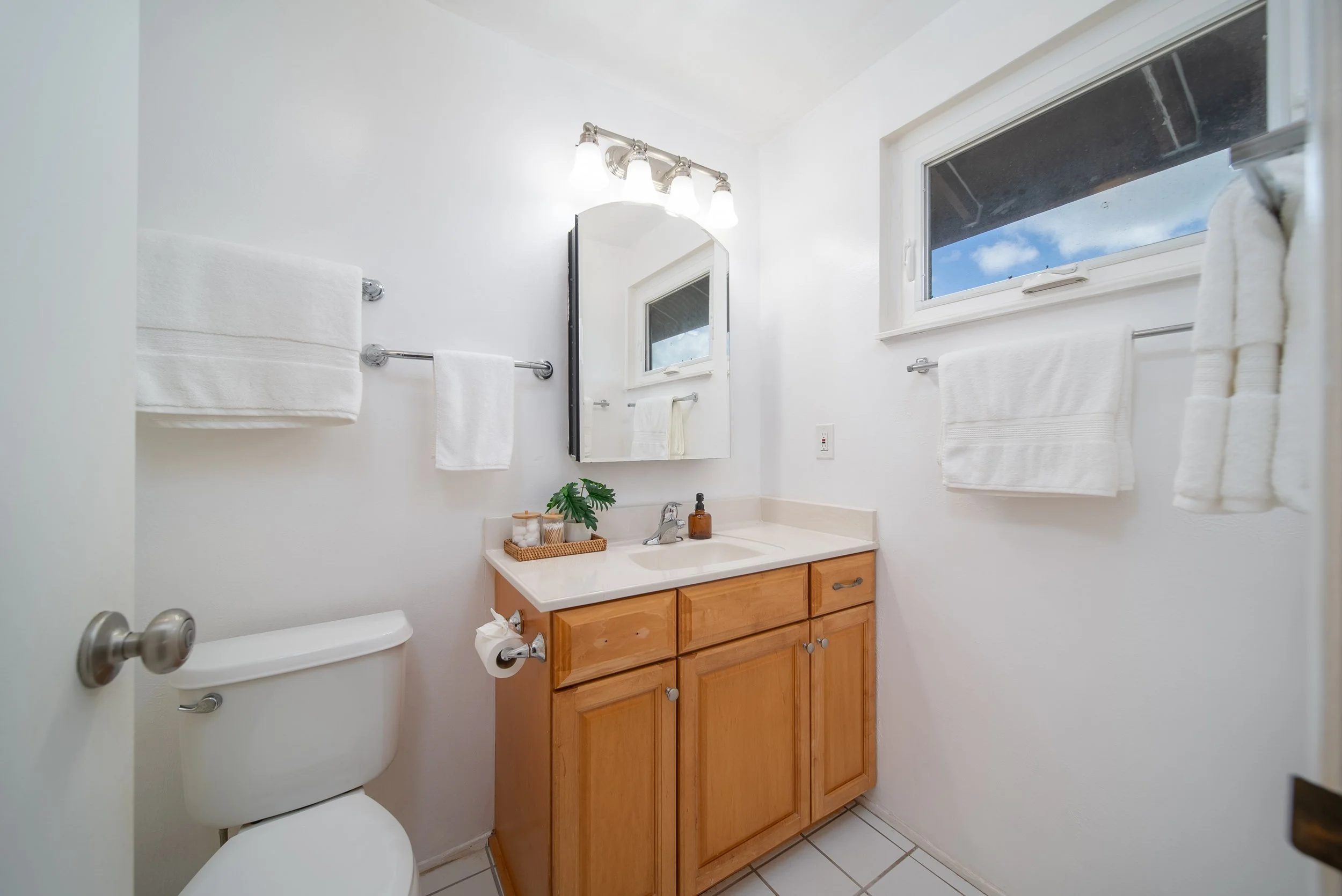 Bathroom with wood vanity, mirror and window, Nob Hill Mililani