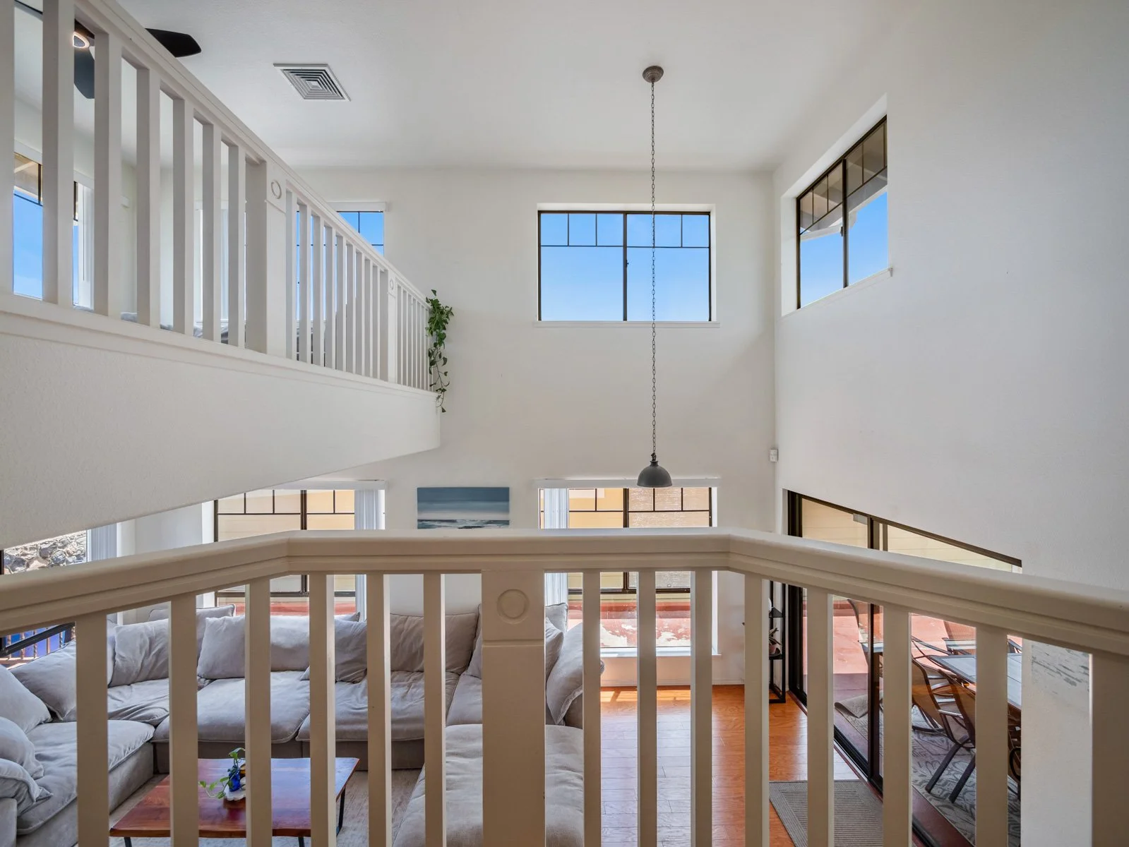 Looking down from the upper landing to the living room below