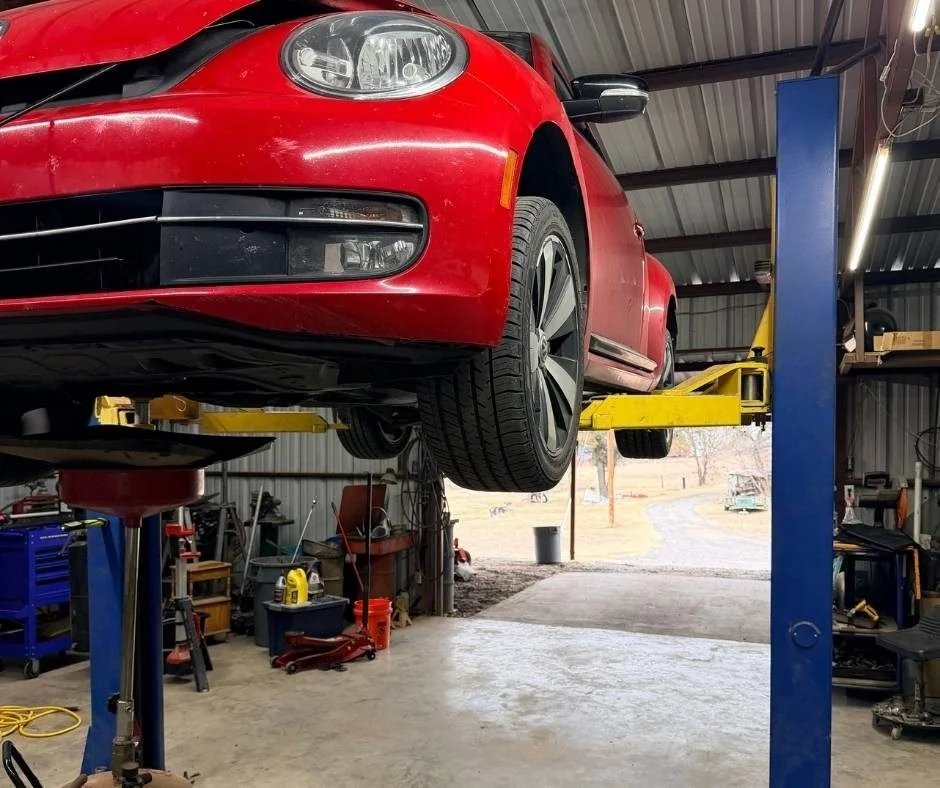 Vehicle on a lift during diagnostic testing at Anchor Automotive in Springtown, Texas