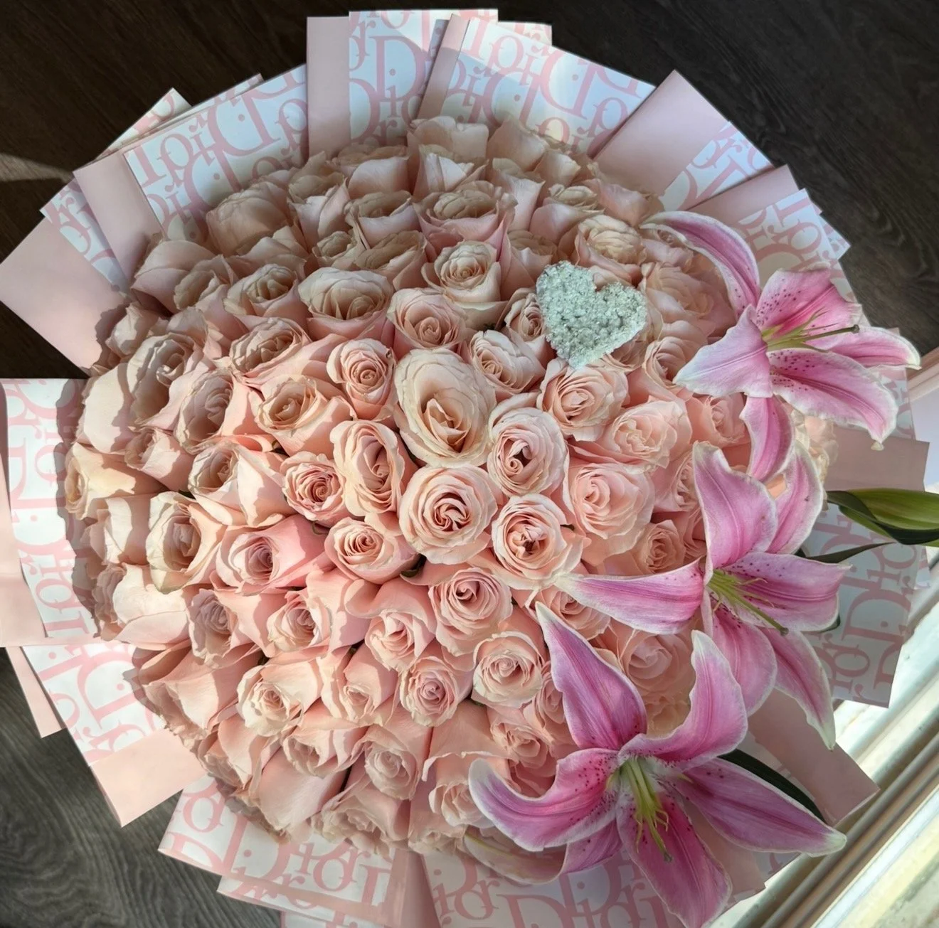 100ct lilies and baby’s breath heart arrangement