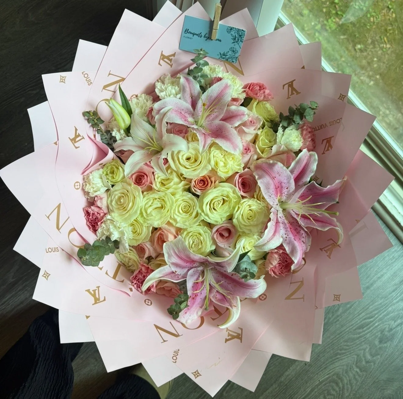 50ct arrangement with lilies eucalyptus and carnation rim