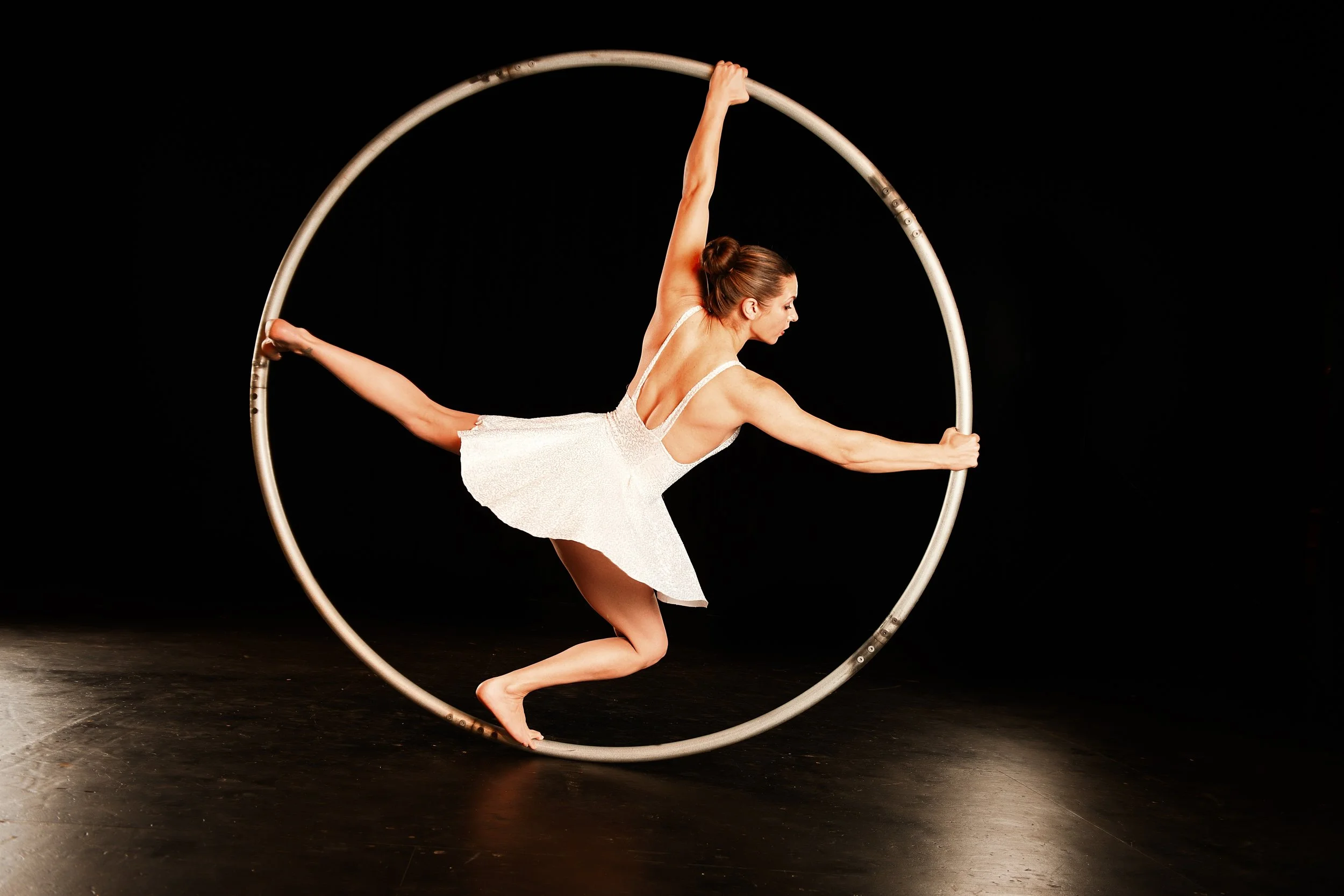 Nicole Londraville balancing inside a cyr wheel