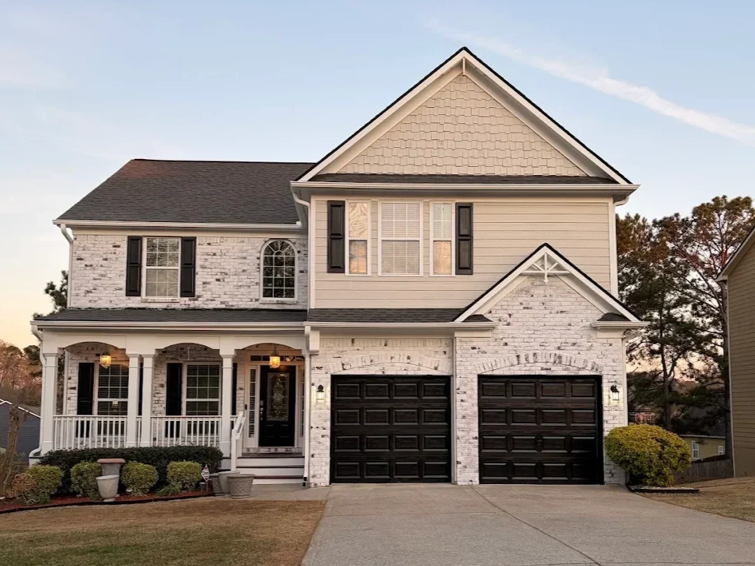 Timeless limewashed brick home exterior completed by Hopewell Painting in Alpharetta, Georgia