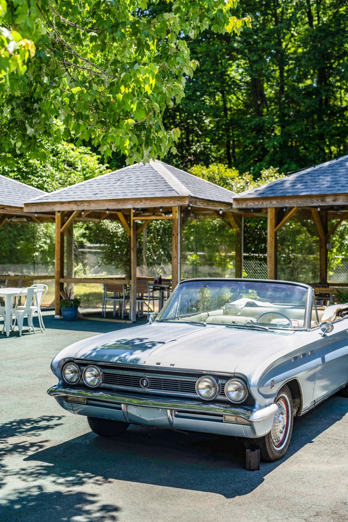 Outdoor seating with a vintage car