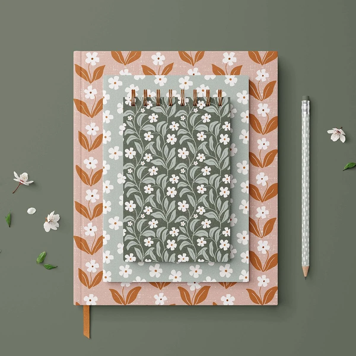 Earthy boho floral surface pattern design on a stationery set, featuring hand-drawn autumn blossoms in warm natural colors.