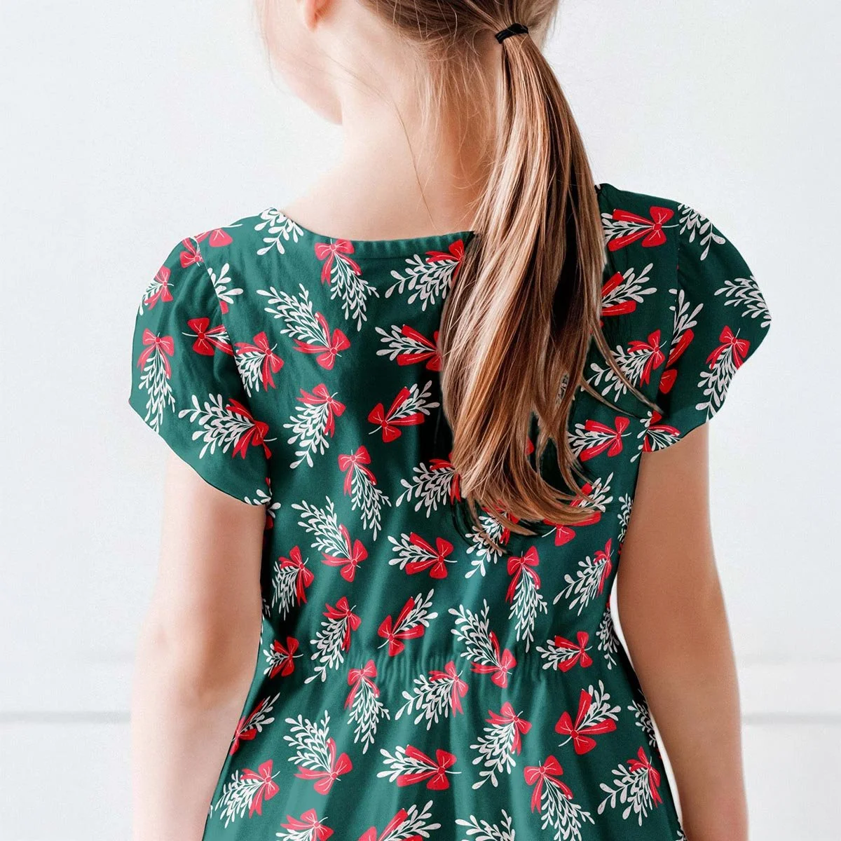 Modern Traditional Christmas pattern featured on a festive children’s dress.
