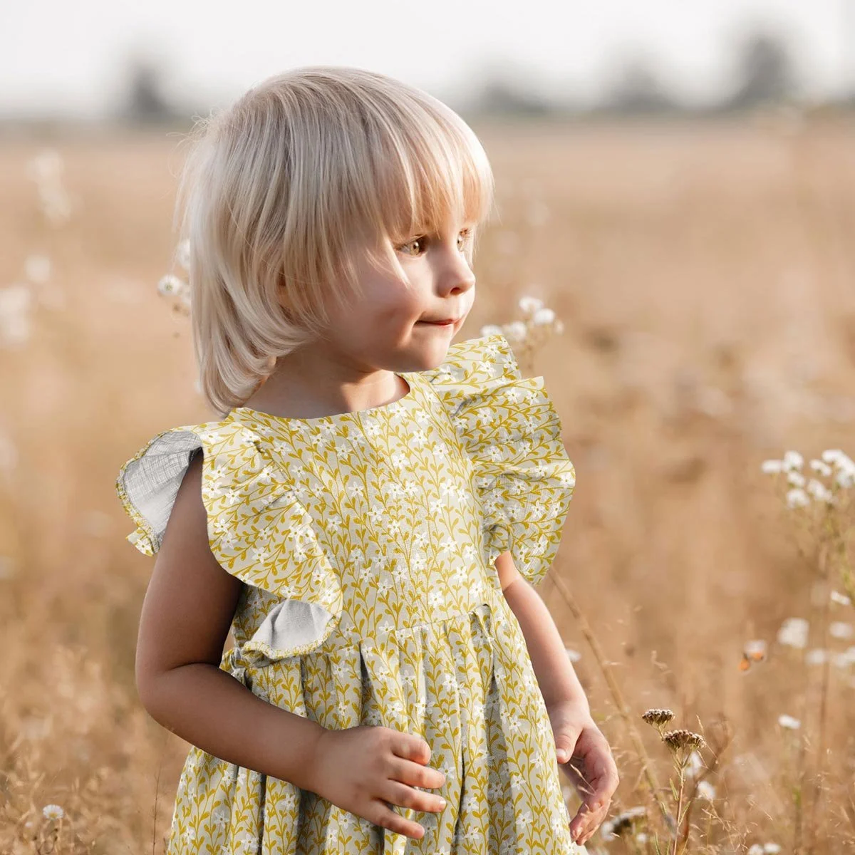 Autumn floral seamless pattern fabric featured on a girl’s dress, designed for children’s clothing and seasonal sewing projects.