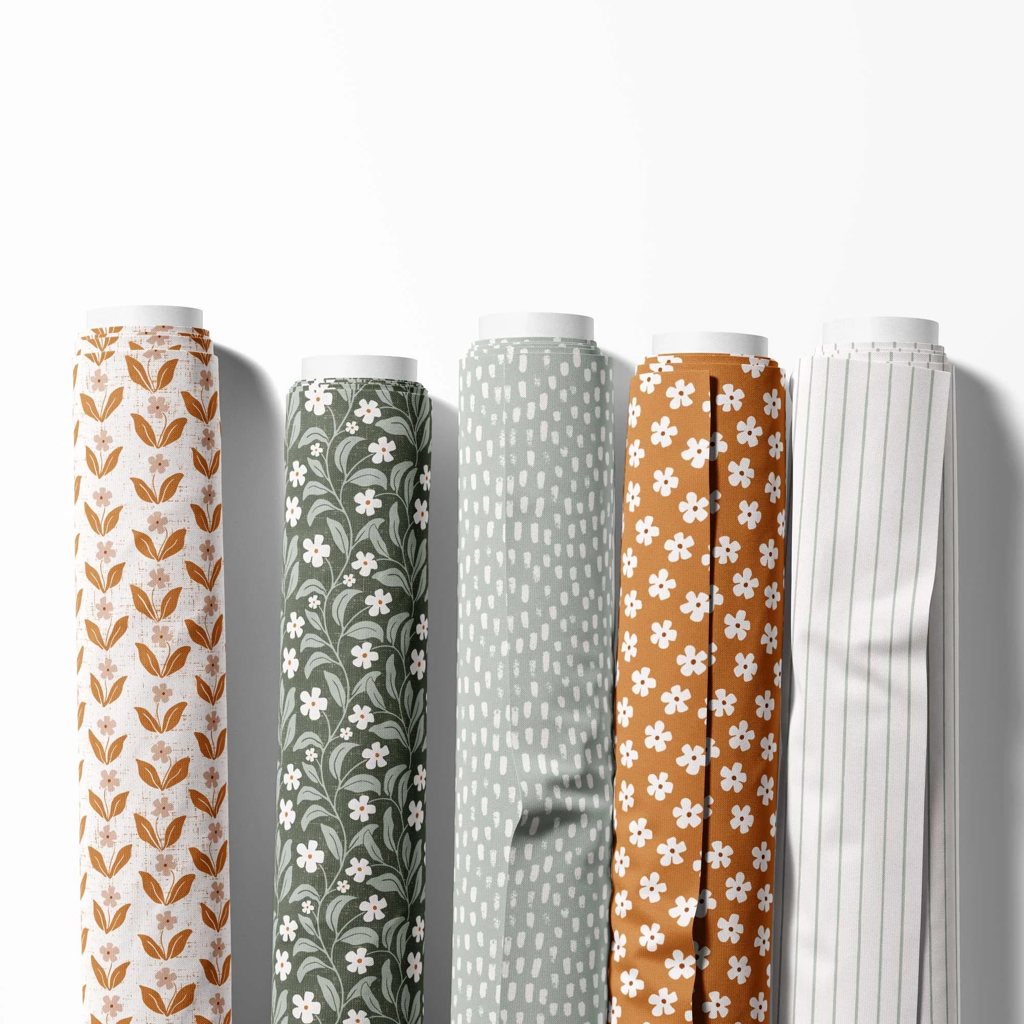 Earthy Blossom floral surface pattern collection in warm ochre, cream and muted green tones.