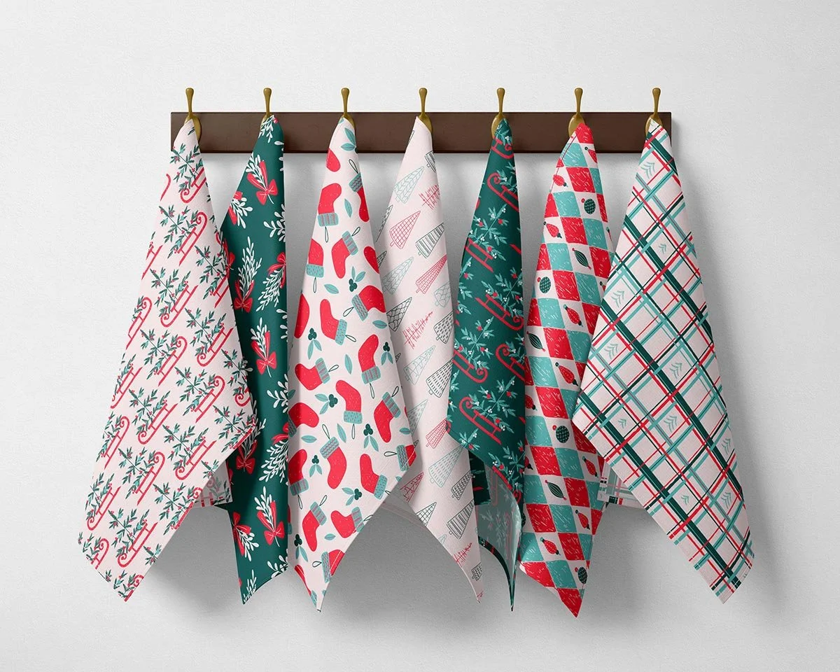 Modern Traditional Cozy Christmas patterns displayed on festive tea towels in red, turquoise and deep green.