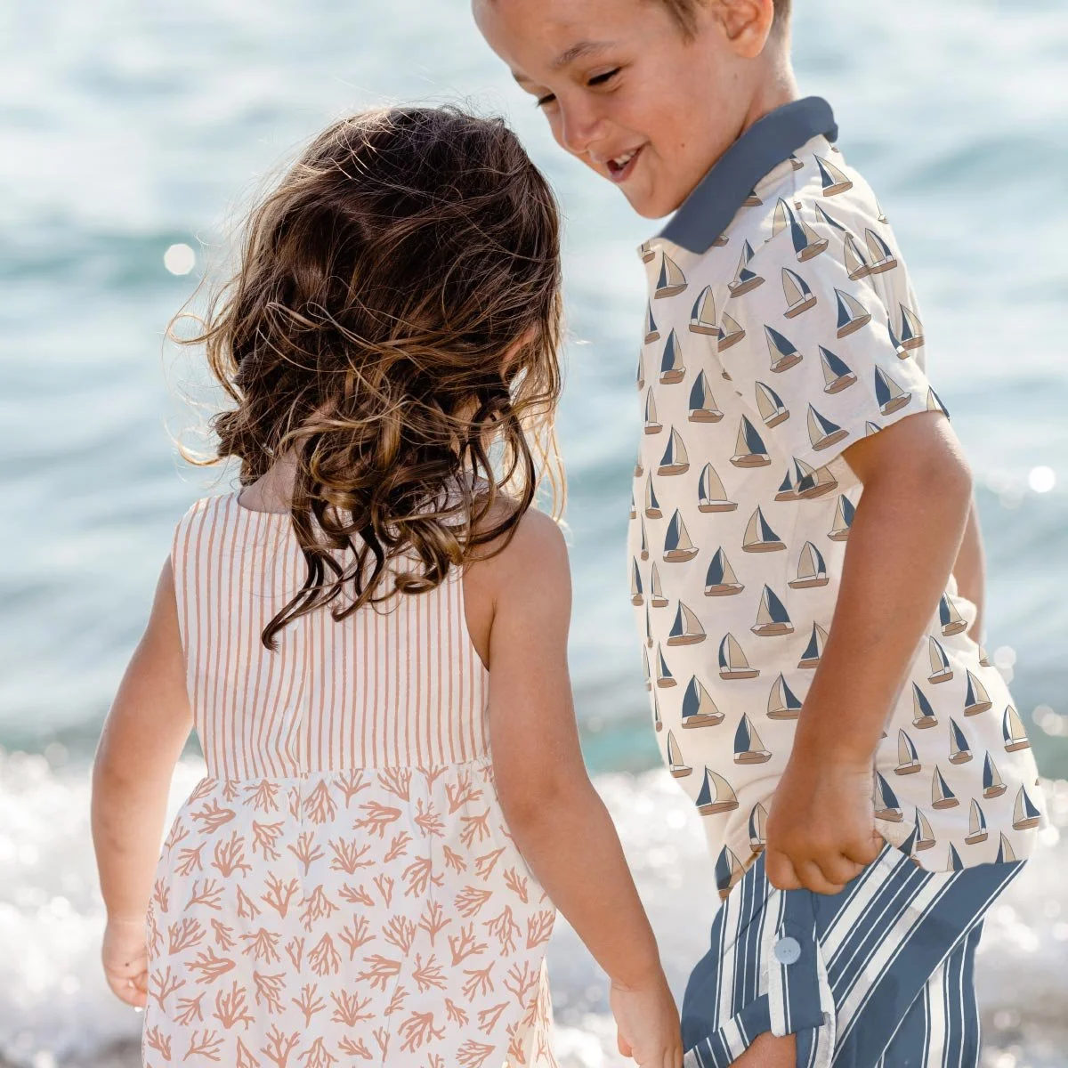 Classic nautical seamless pattern fabric with coastal motifs for children’s clothing, swimwear, accessories and seaside home décor.
