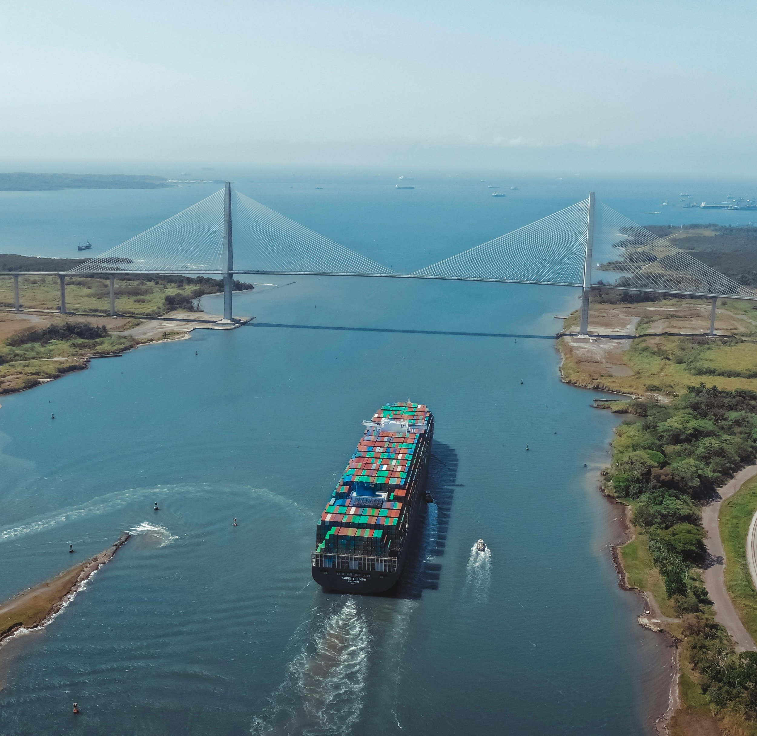 Panama Canal aerial, container ship under the Centennial Bridge