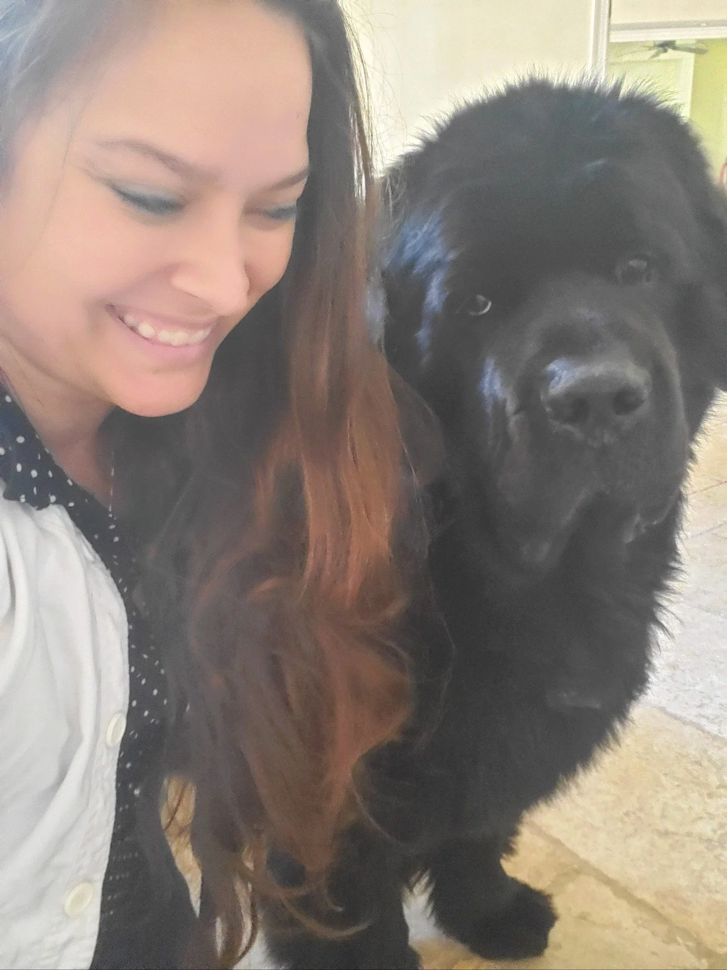 Dr. Meghan with a large black dog