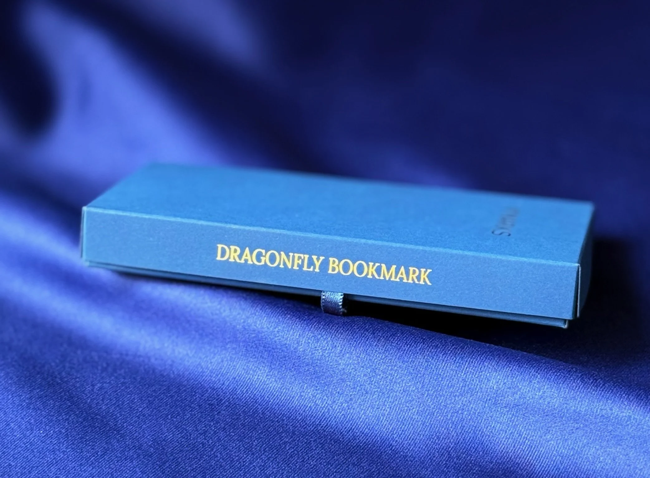 N'marks Dragonfly Bookmark box — DRAGONFLY BOOKMARK in gold foil on navy spine