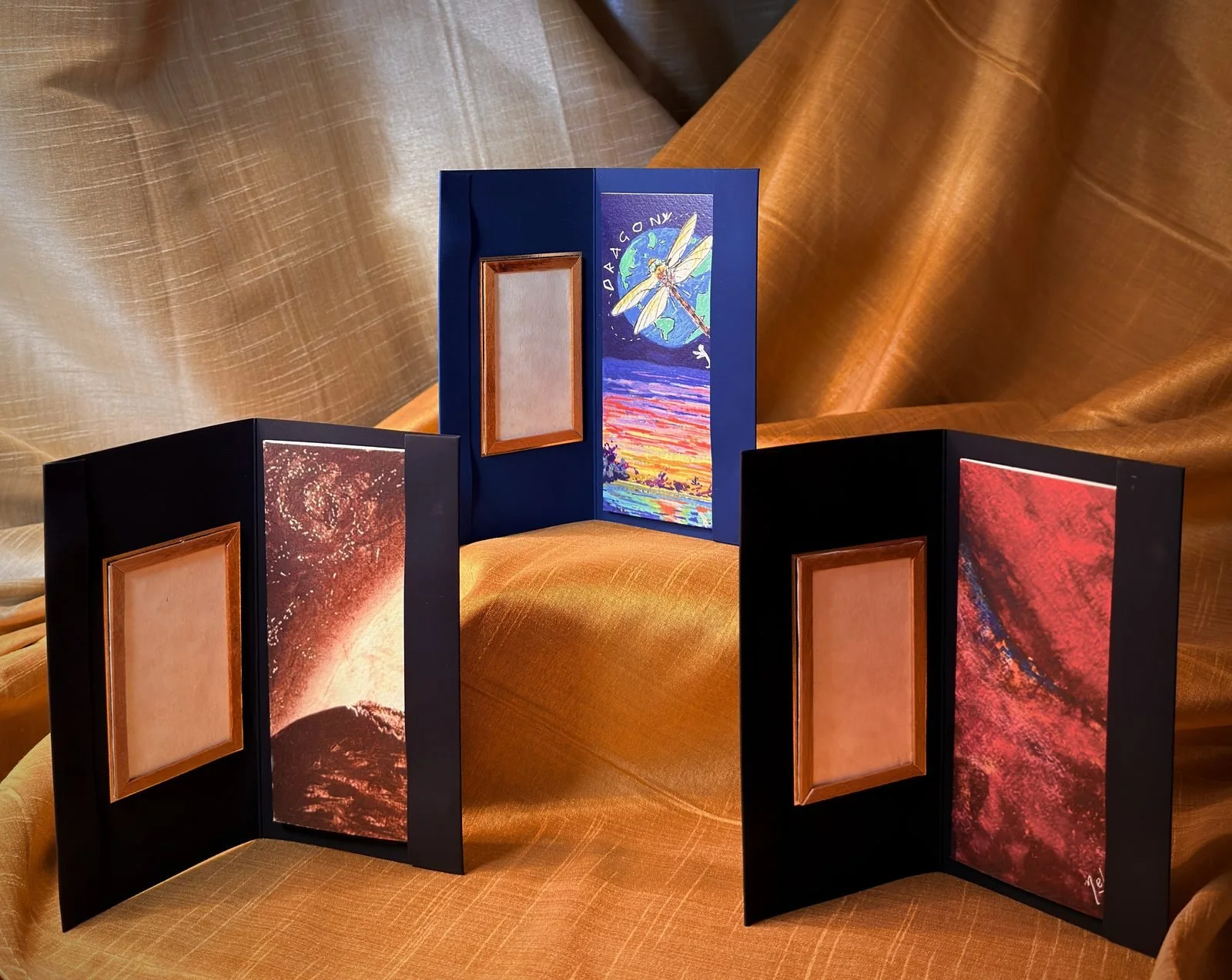 The Tesera cards, standing open