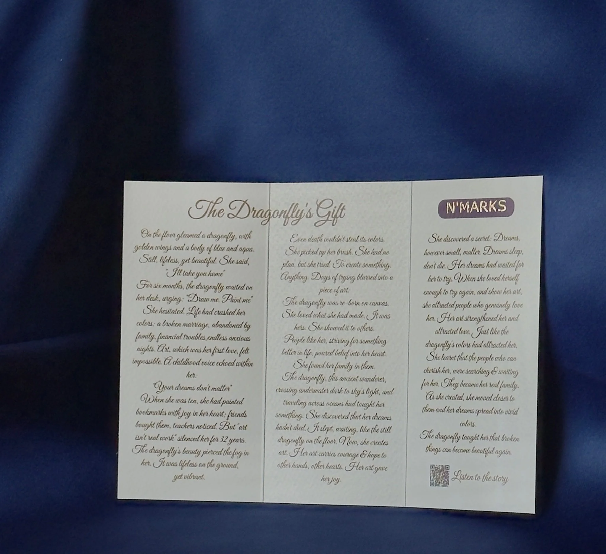 The Dragonfly's Gift story card open — trifold showing the full story