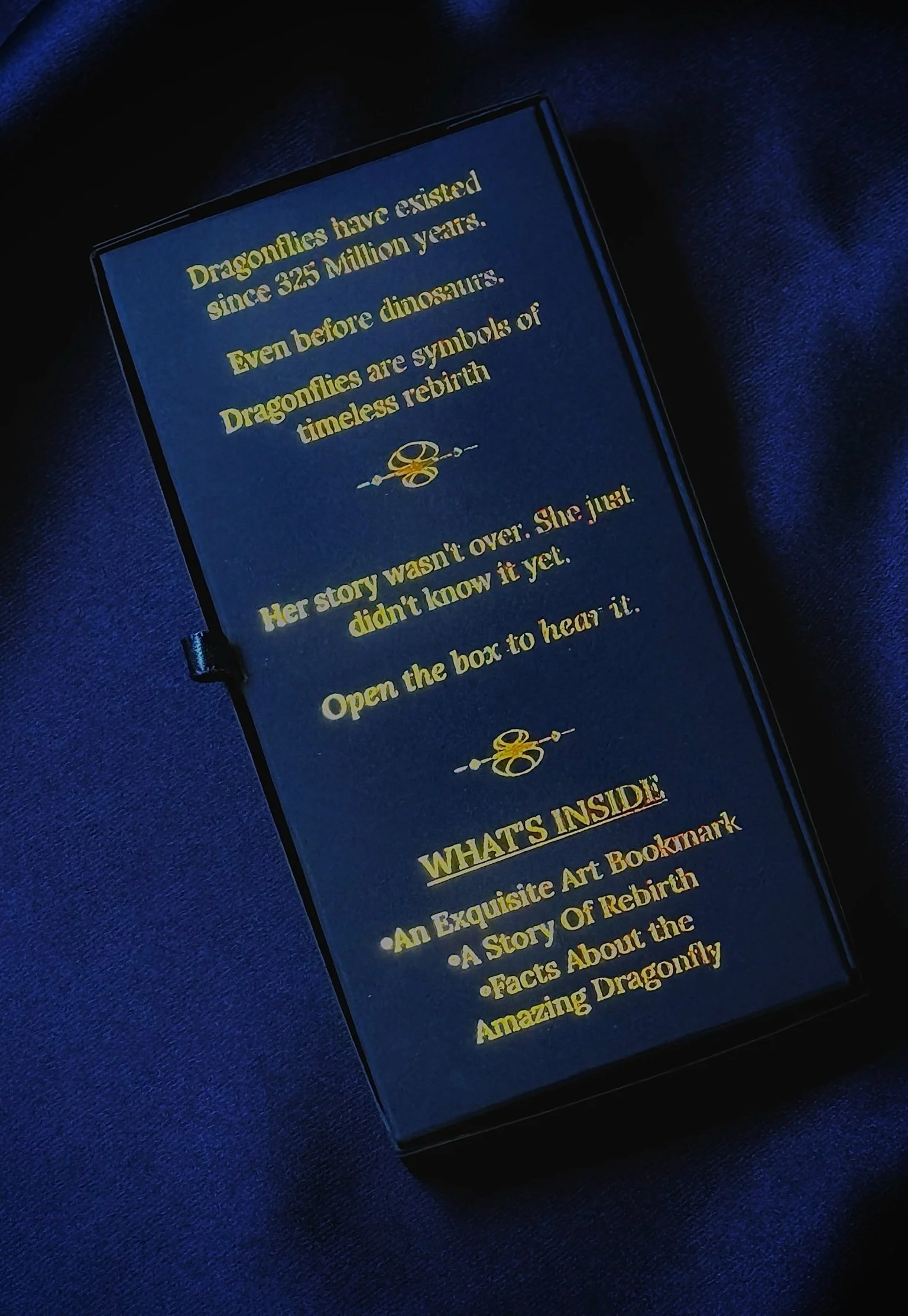 N'marks Dragonfly Bookmark box — back panel showing story copy in gold foil