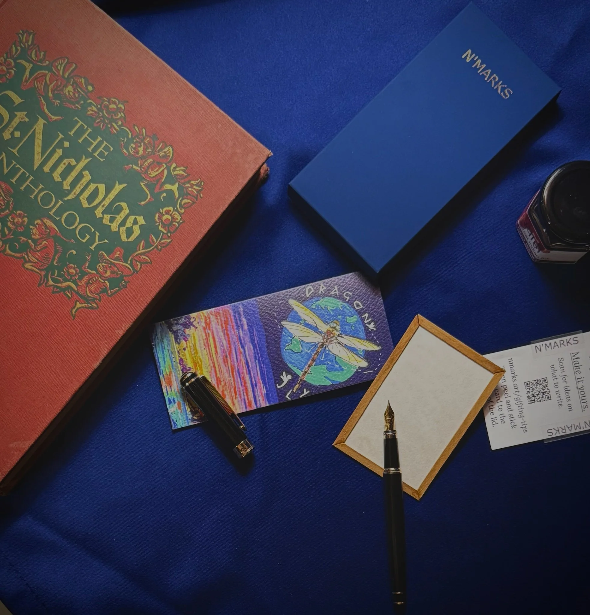 N'marks Dragonfly Bookmark — flat lay with book, pen and gift card