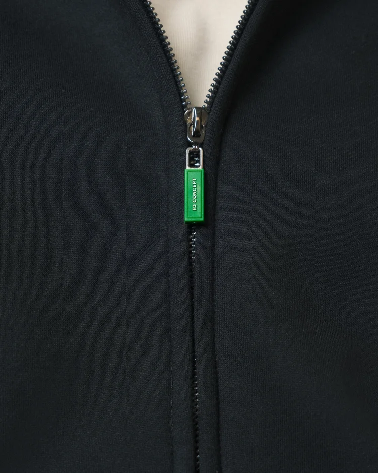Black R3 CONCEPT hoodie zipper with a green branded pull