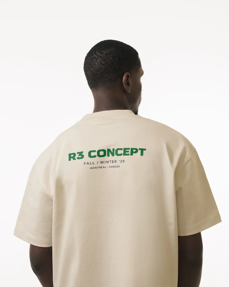Green R3 CONCEPT collection print on the back of a cream T-shirt