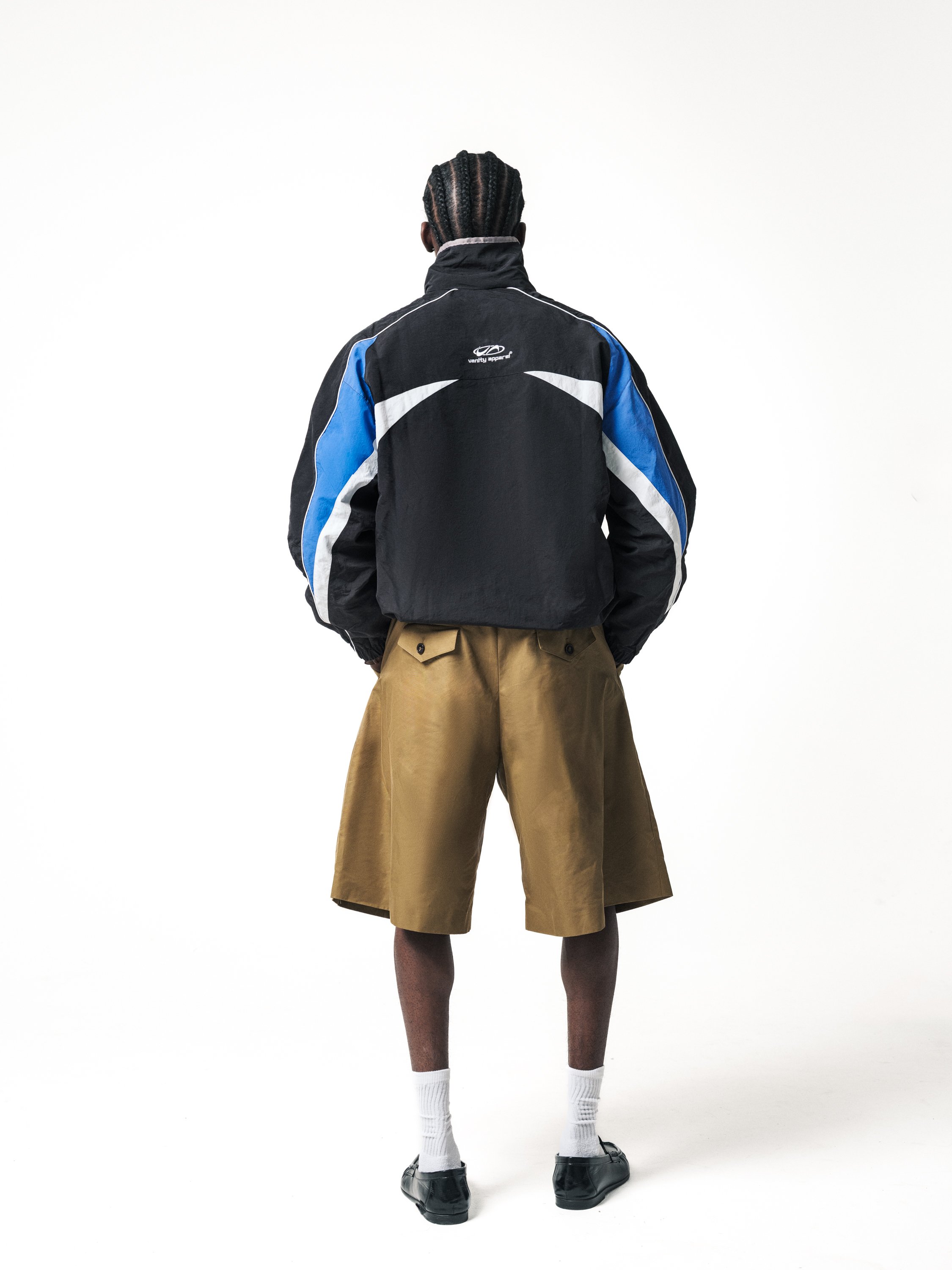 E-commerce fashion image showing male model back view and jacket detail