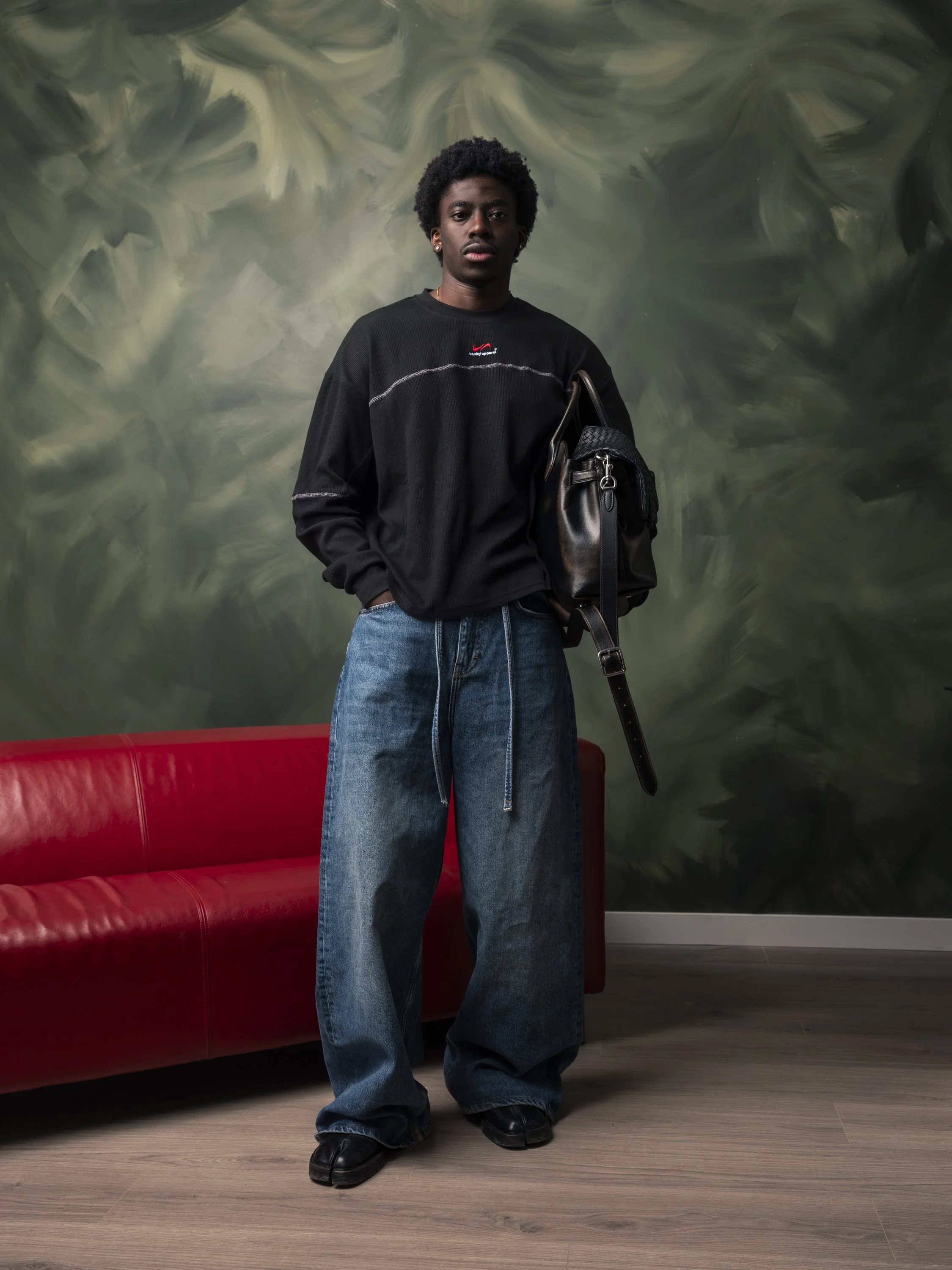 Fashion editorial portrait with controlled styling, studio lighting, and a composed visual direction