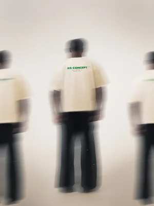 R3 CONCEPT cream T-shirt back print framed by motion-blurred figures