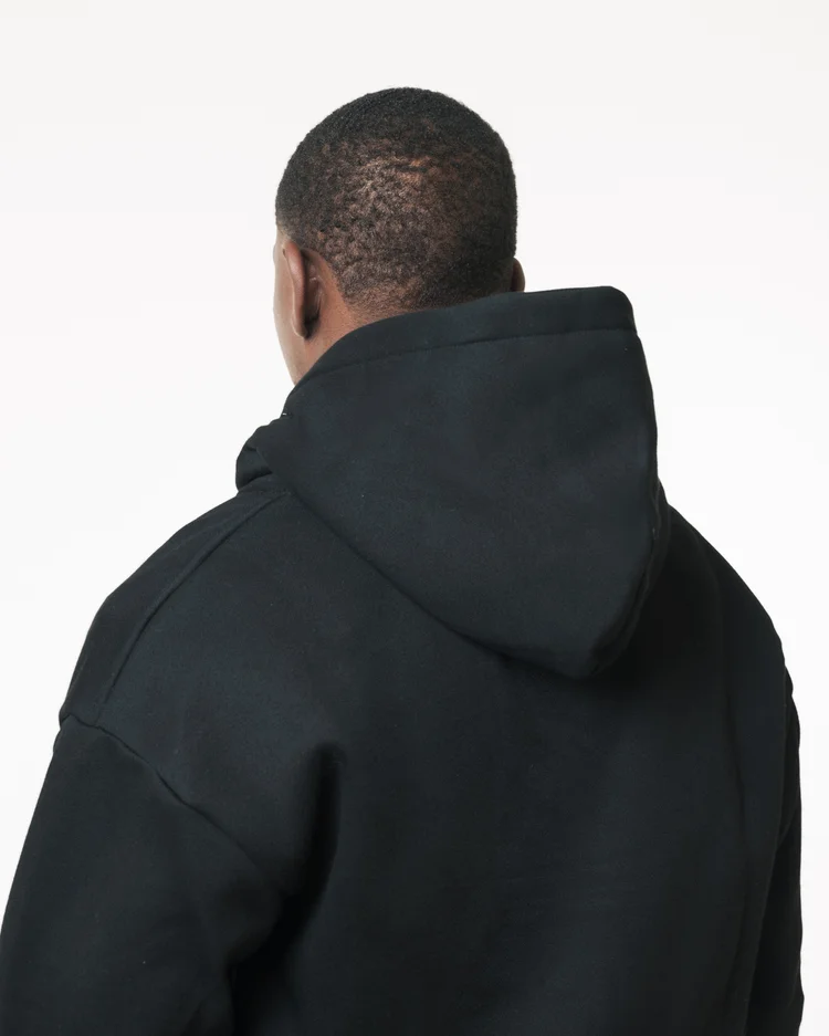 Close back view showing the hood and shoulder construction of a black R3 CONCEPT hoodie