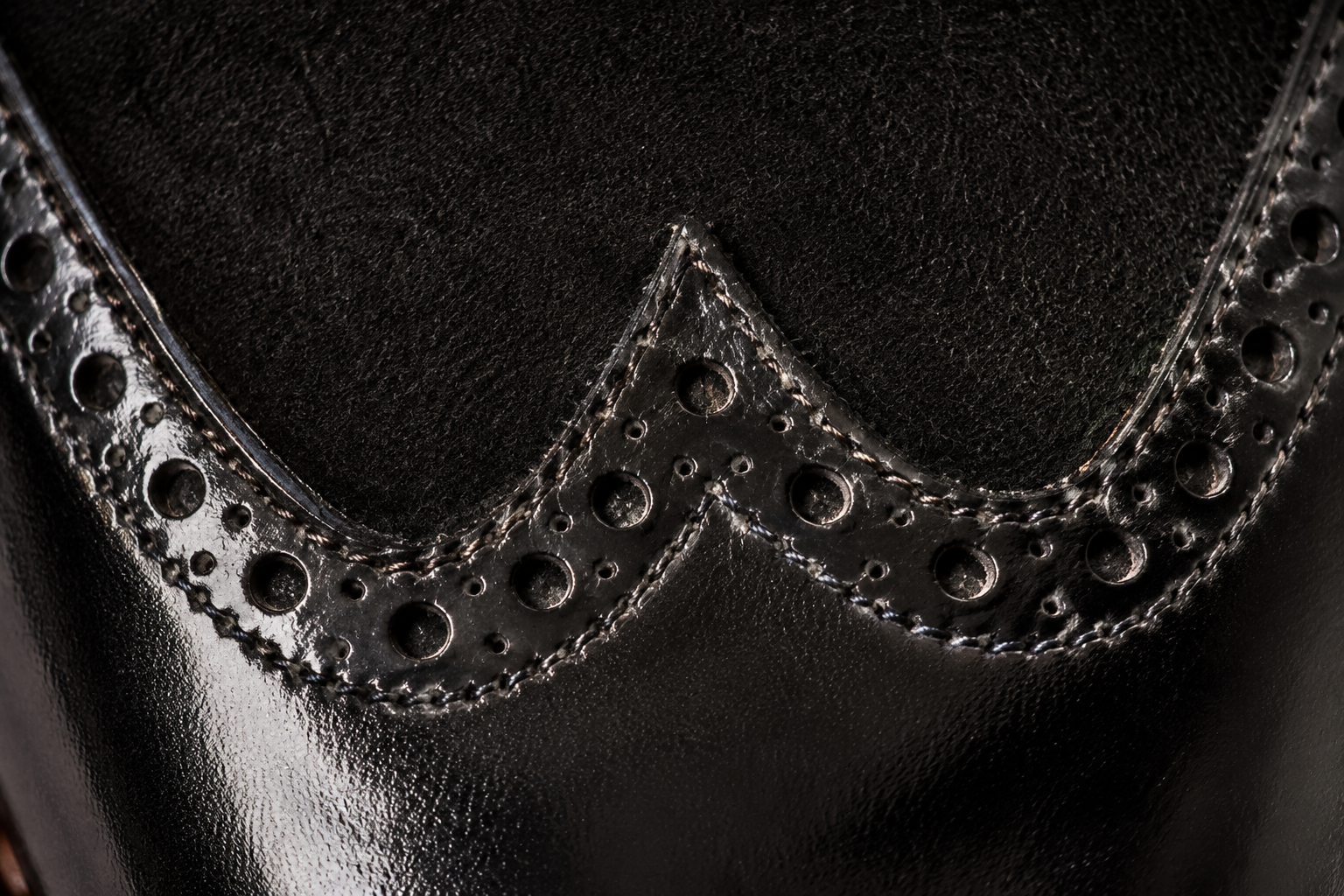 W-seam calf + suede junction macro