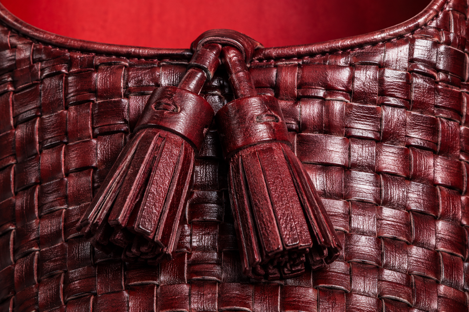 Twin tassels on woven burgundy throat macro