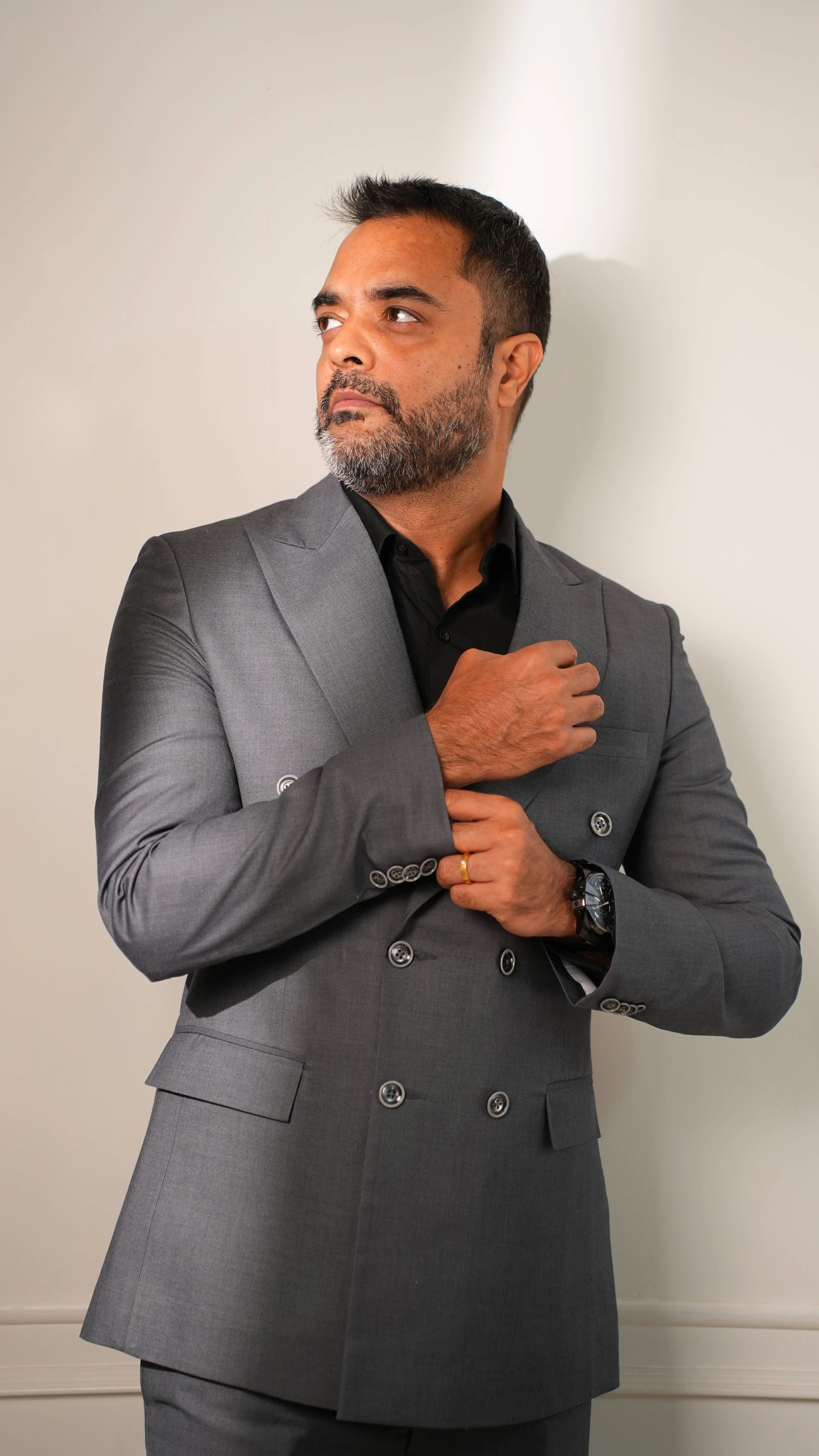 Double-breasted bespoke suit with peak lapels