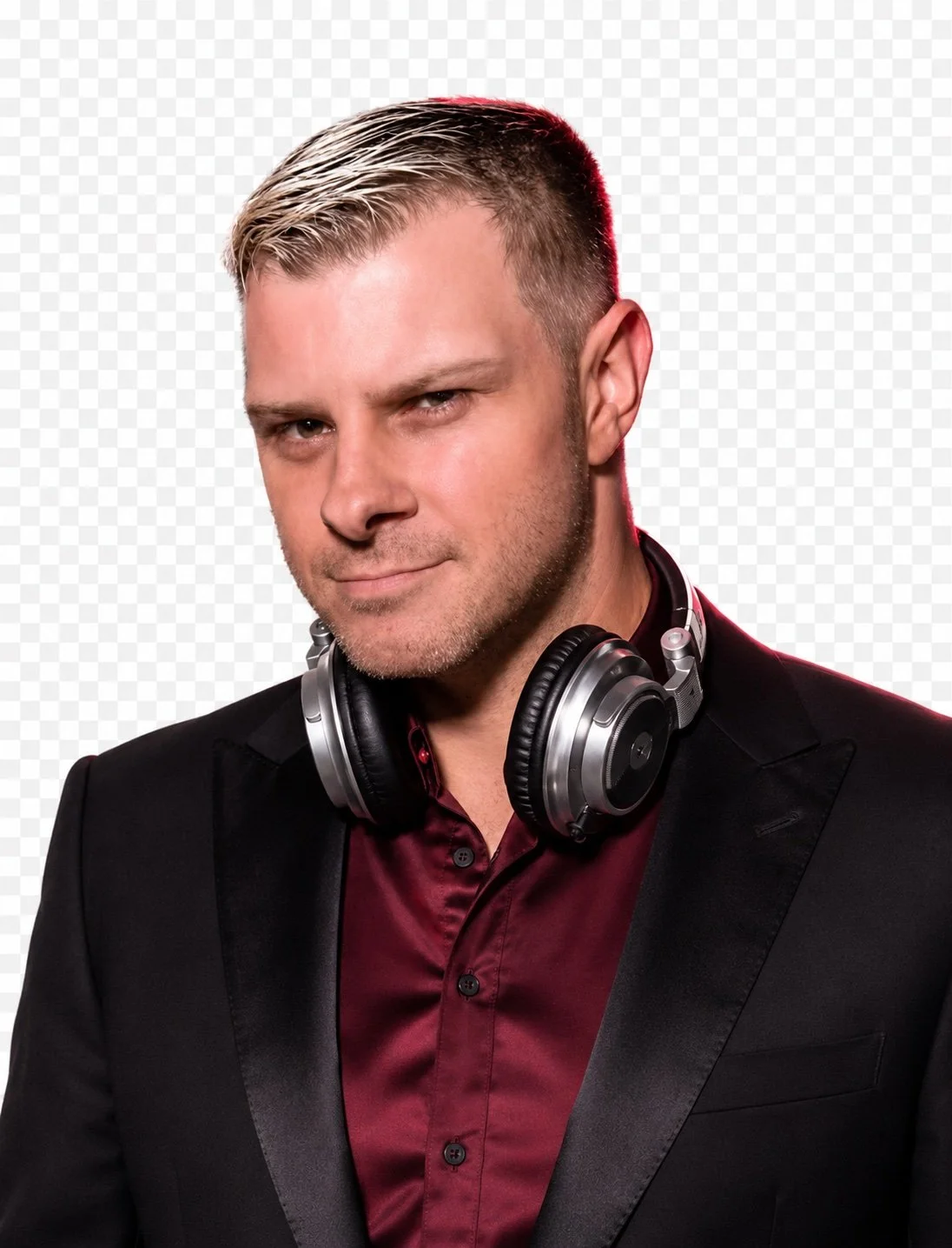 DJ JD wearing headphones, a black jacket and burgundy shirt