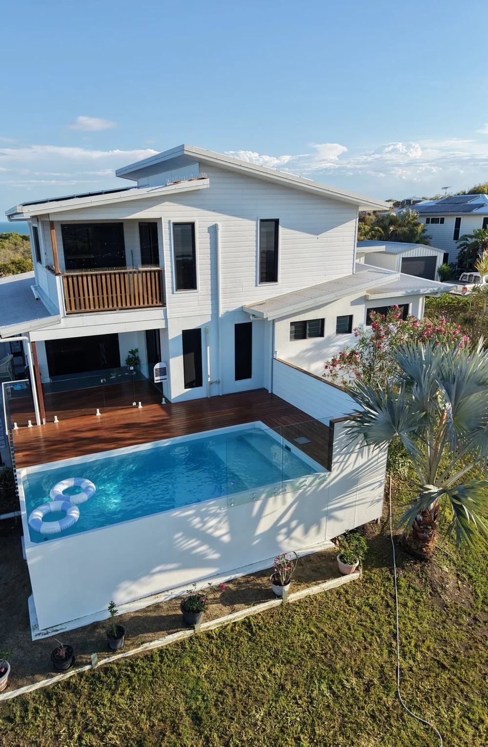 Hideaway by Coastline: a Plungie pool with timber deck and glass fencing