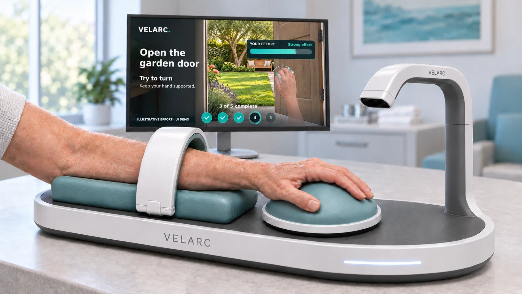 The VELARC platform supports the forearm and hand, with an overhead movement sensor and interactive practice display.