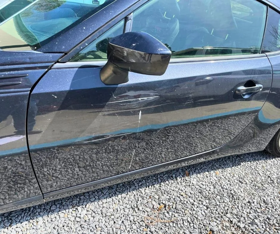 Subaru door repair — before