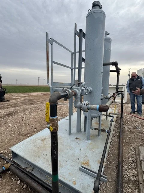 Wellsite vessels and piping with Kansas fields behind