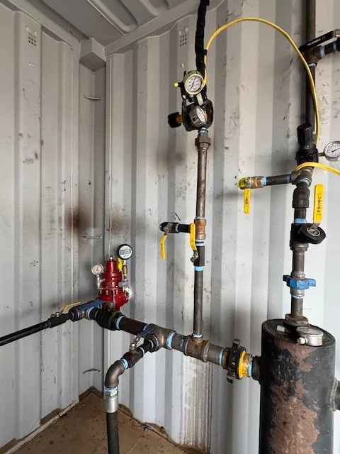 Gauges, valves and piping on a wall