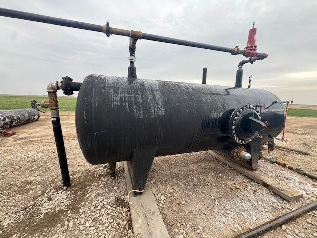 Large black horizontal water separation tank