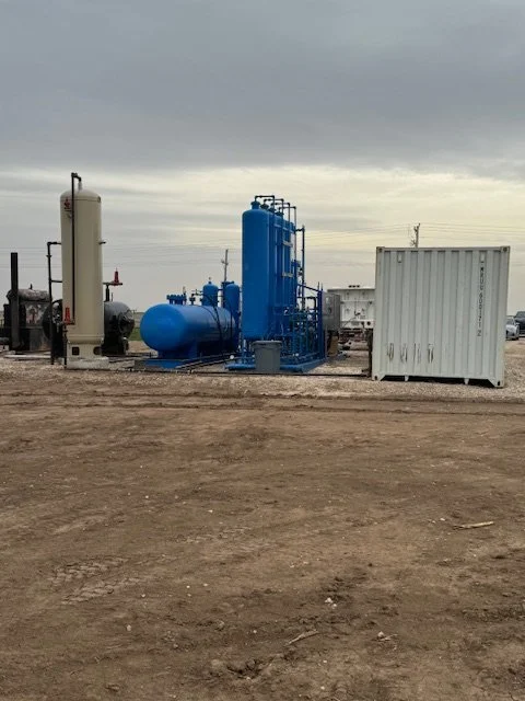 Processing equipment and an equipment building at the wellsite