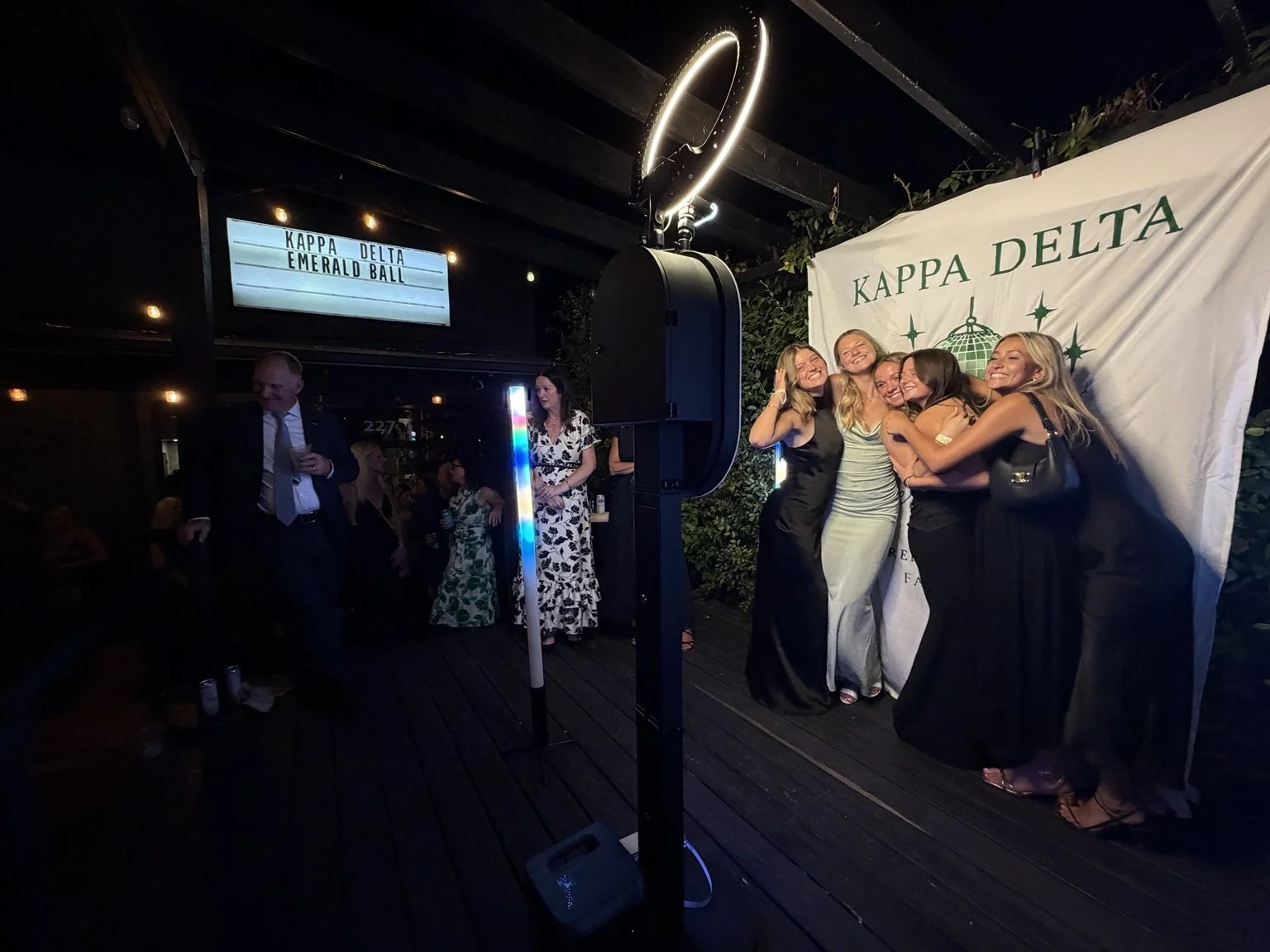 Guests gathered beside the Classic City booth at Kappa Delta Emerald Ball