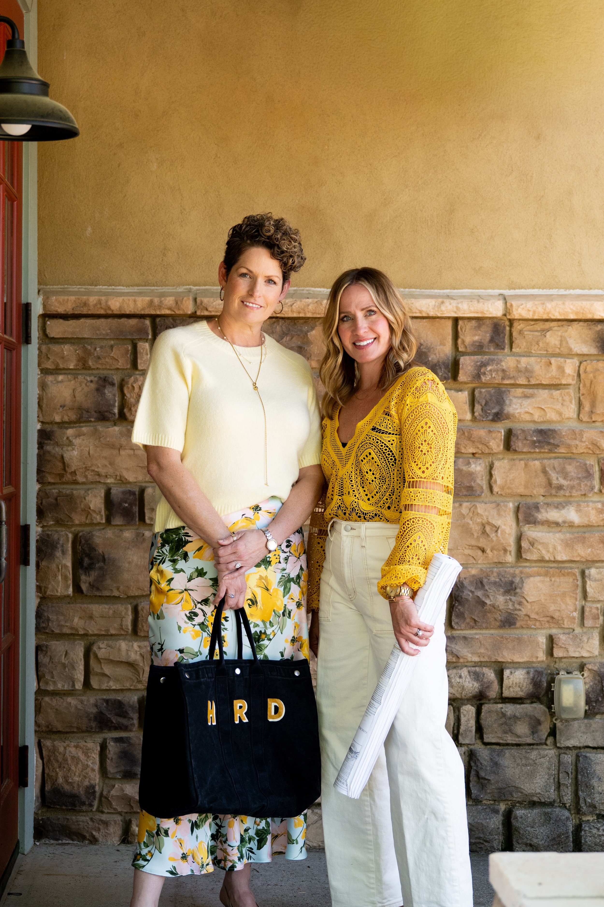 Howard Reid Design founders Chrissy Howard and Courtney Reid with the HRD tote near Lake Keowee, South Carolina